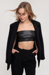 Black leather lace-up top, eco-leather top, lace-up top, adjustable leather top, stylish black leather top, eco-friendly leather top, leather lace-up blouse, black eco-leather clothing, lace-up fashion top, sustainable leather fashion, adjustable eco-leather top, black lace-up shirt, eco-conscious leather clothing, modern leather lace-up design, black leather blouse.